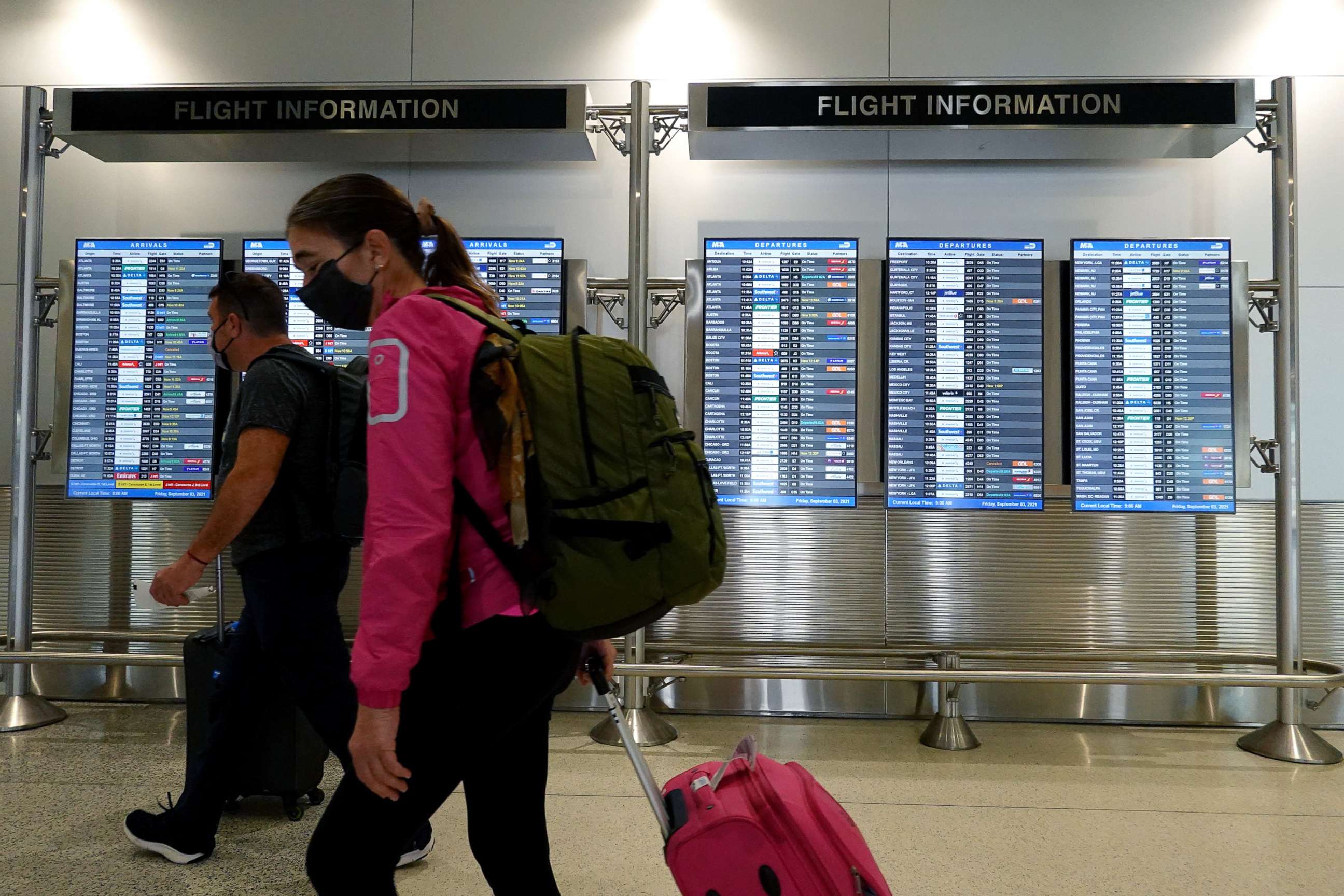 PHOTO: Travelers make their way through the Miami International Airport ahead of Labor Day weekend, Sept. 3, 2021, in Miami.