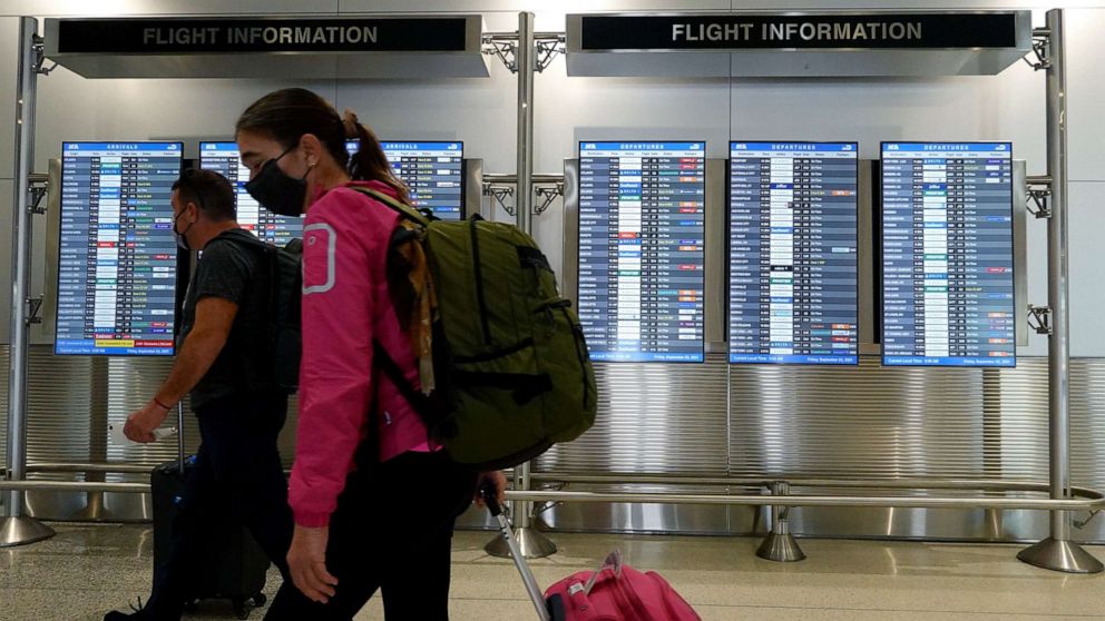PHOTO: Travelers make their way through the Miami International Airport ahead of Labor Day weekend, Sept. 3, 2021, in Miami.