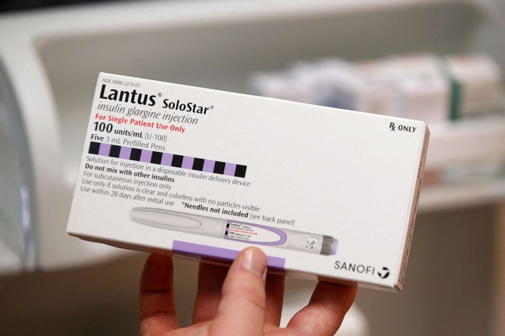 PHOTO: A pharmacist holds a box of the drug Lantus SoloStar, made by Sanofi Pharmaceutical, at a pharmacy in Provo, Utah, Jan. 9, 2020.