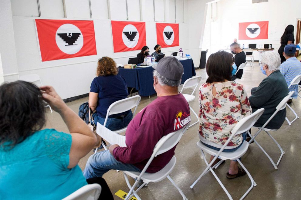 PHOTO: People wait in an observation area after receiving doses of the Johnson & Johnson and Pfizer Covid-19 vaccines at a vaccination site organized by UFW, Kern Medical, and the Kern County Latino Covid-19 Task Force on March 13, 2021 in Delano, Calif.