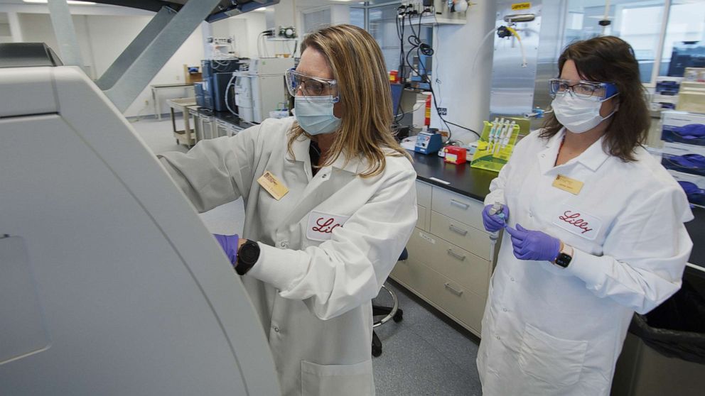 PHOTO: In this May 2020 photo provided by Eli Lilly, researchers prepare mammalian cells to produce possible COVID-19 antibodies for testing in a laboratory in Indianapolis. 