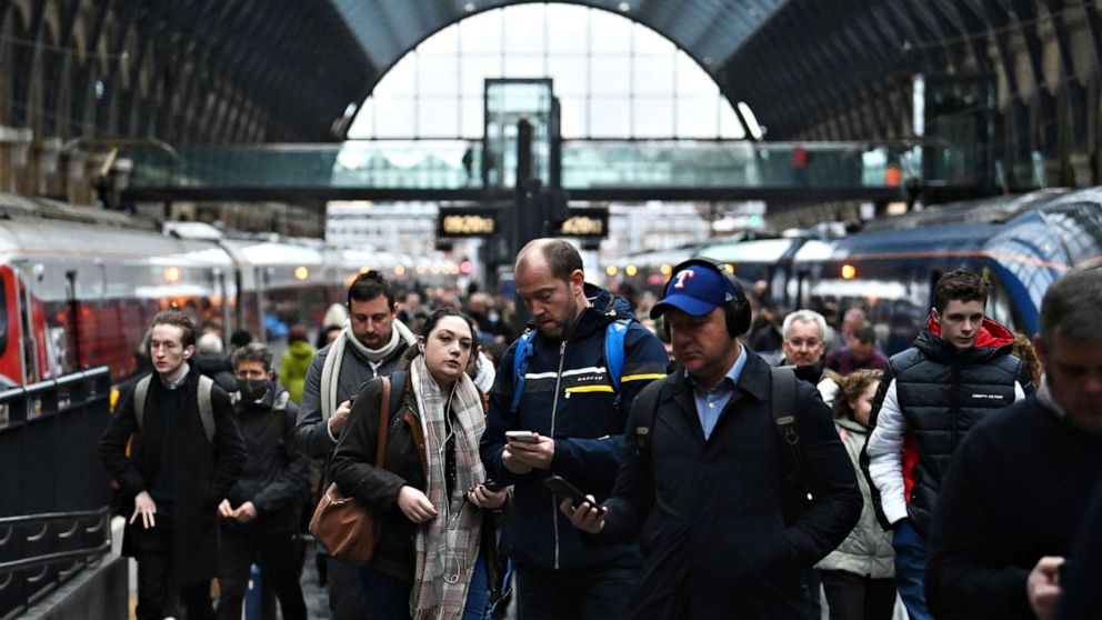 PHOTO: Travelers arrive at Kings Cross station in London, Feb. 24, 2022. All remaining legal Covid restrictions have been removed in England.