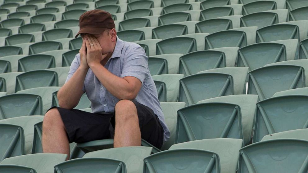 PHOTO: An undated stock photo shows a man siting in an empty stadium.