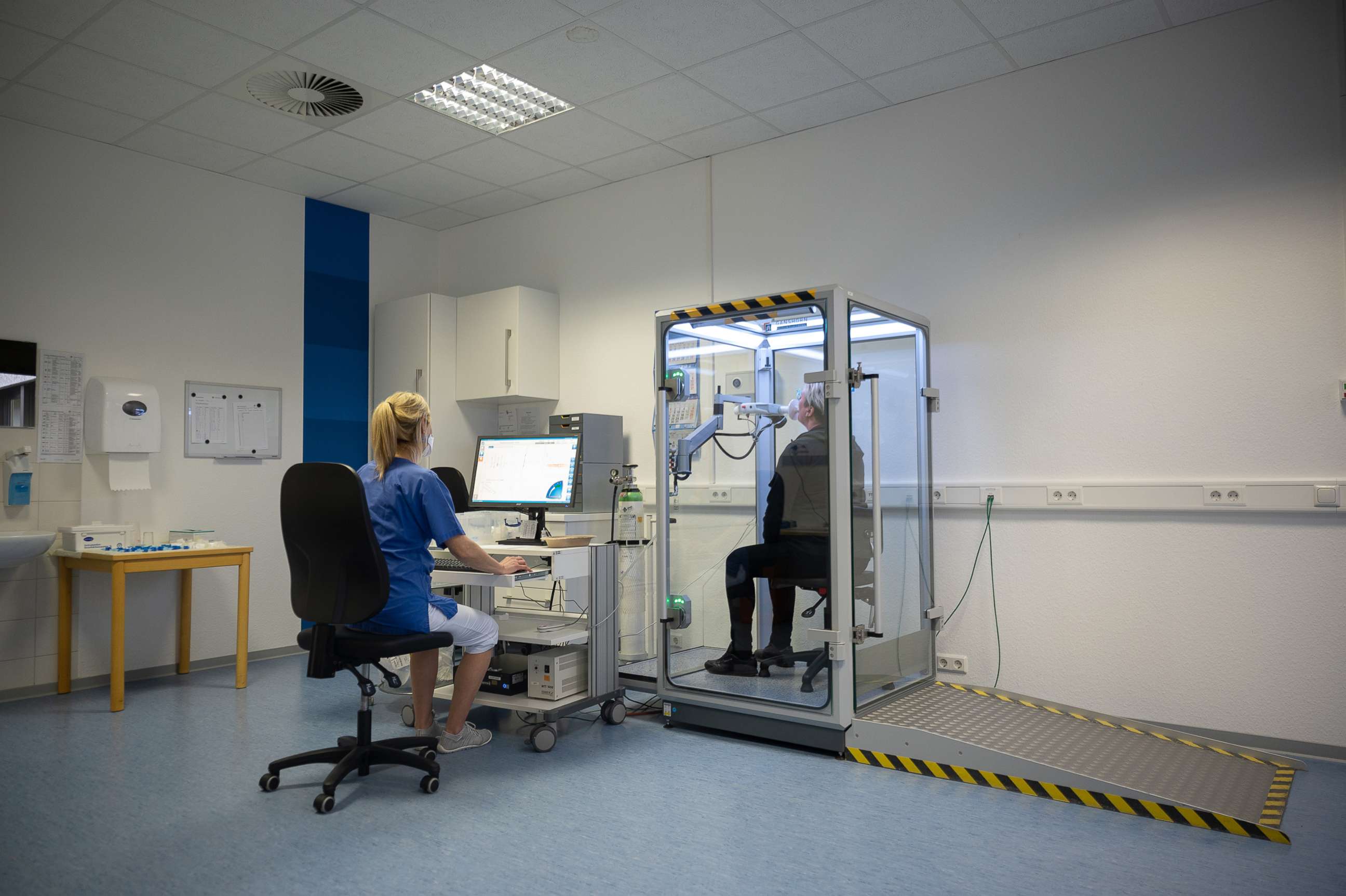 PHOTO: A long Covid-19 patient takes a lung function test at the Hufeland Clinic, Feb. 7, 2022, in Bad Ems, Germany.