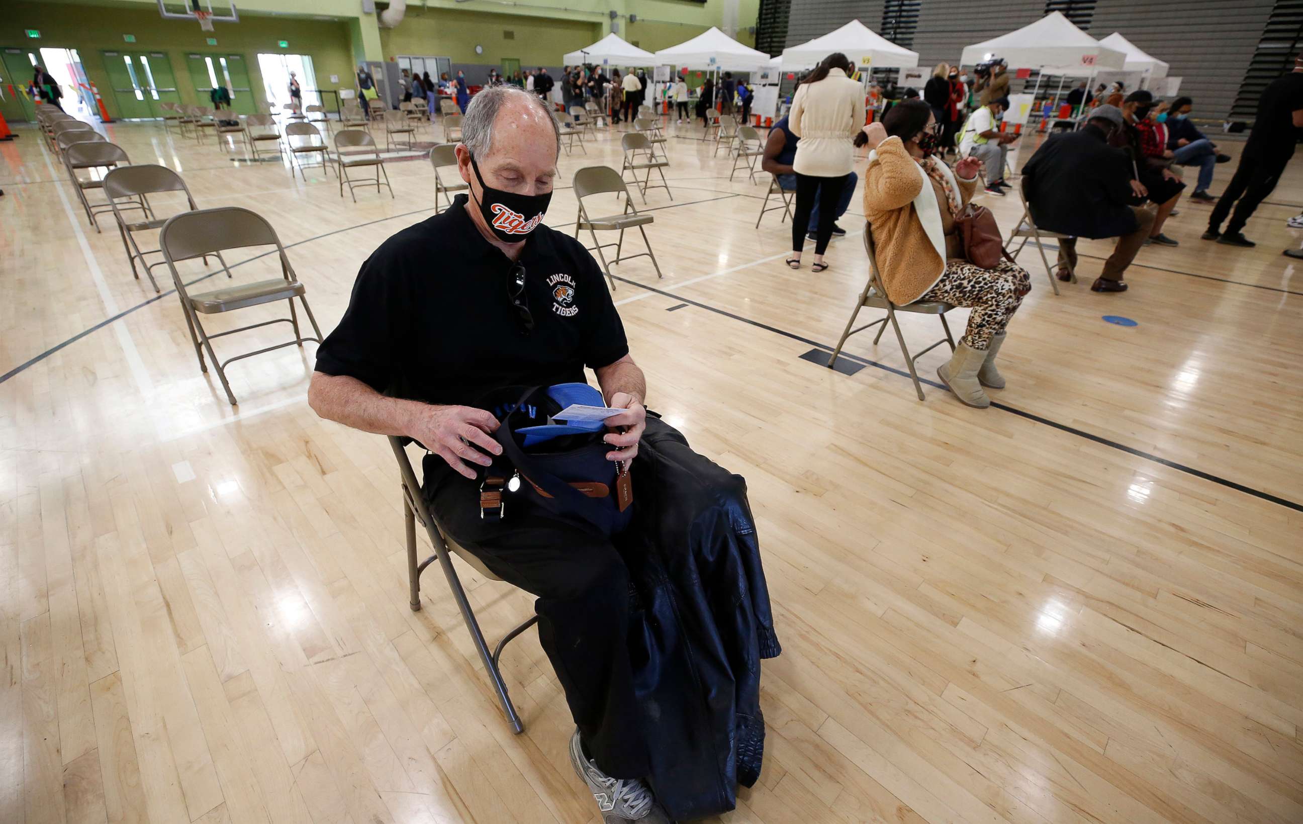PHOTO: Lincoln High School teacher Nathan Windman, 71, waits for observation after receiving his COVID-19 vaccination as Los Angeles Unified employees received their first dose of the vaccine, Feb. 17, 2021, in Los Angeles.