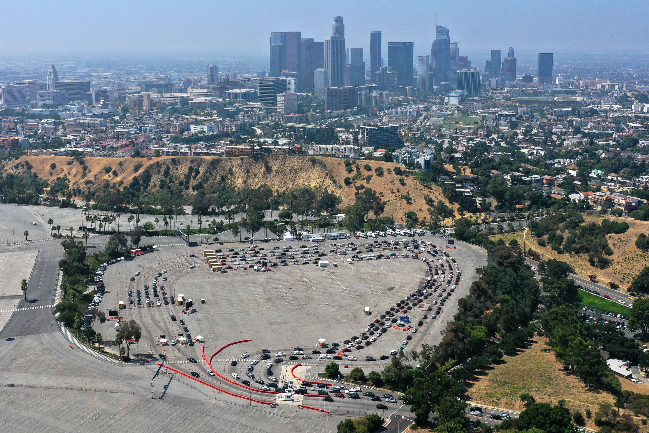 PHOTO: Cars line up at a drive-through coronavirus disease (COVID-19) testing site at Dodger Stadium in Los Angeles, July 16, 2020.