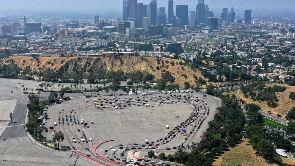 PHOTO: Cars line up at a drive-through coronavirus disease (COVID-19) testing site at Dodger Stadium in Los Angeles, July 16, 2020.