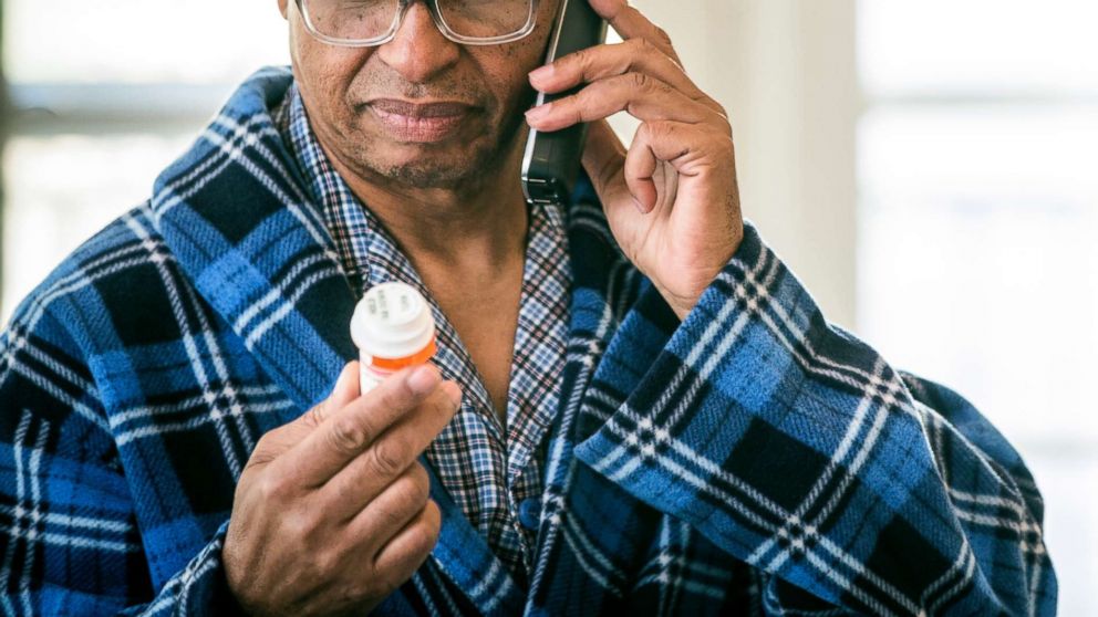 PHOTO: A man refills his prescription by phone in this stock photo.