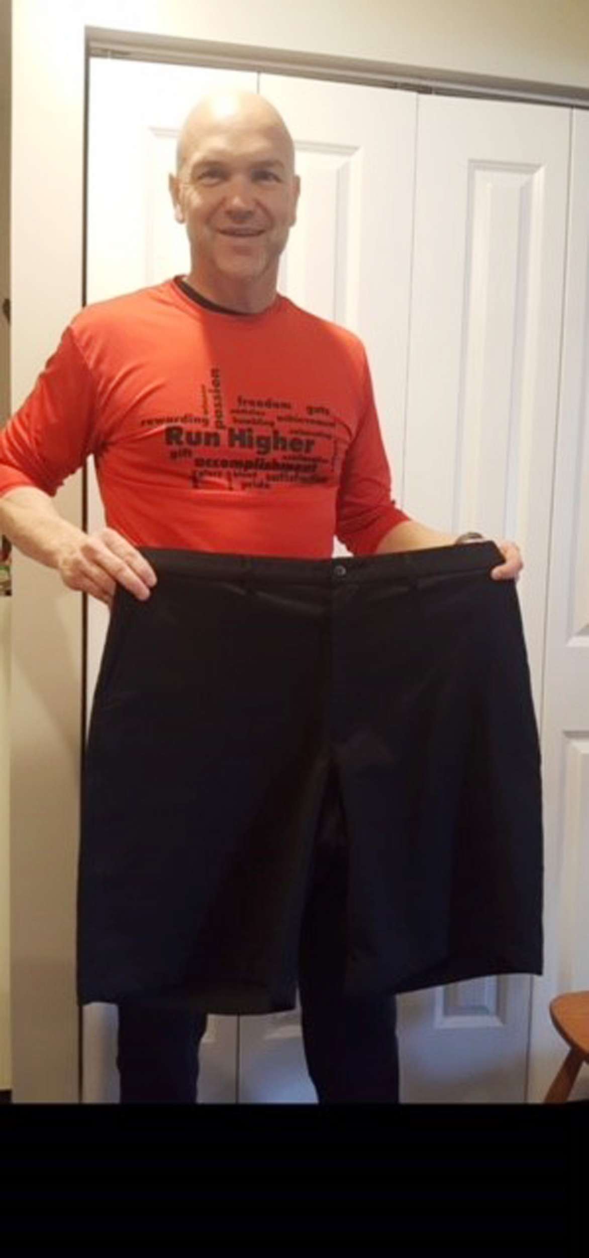 PHOTO: Andy Bell, 45, poses with shorts he wore before his 100-pound weight loss.