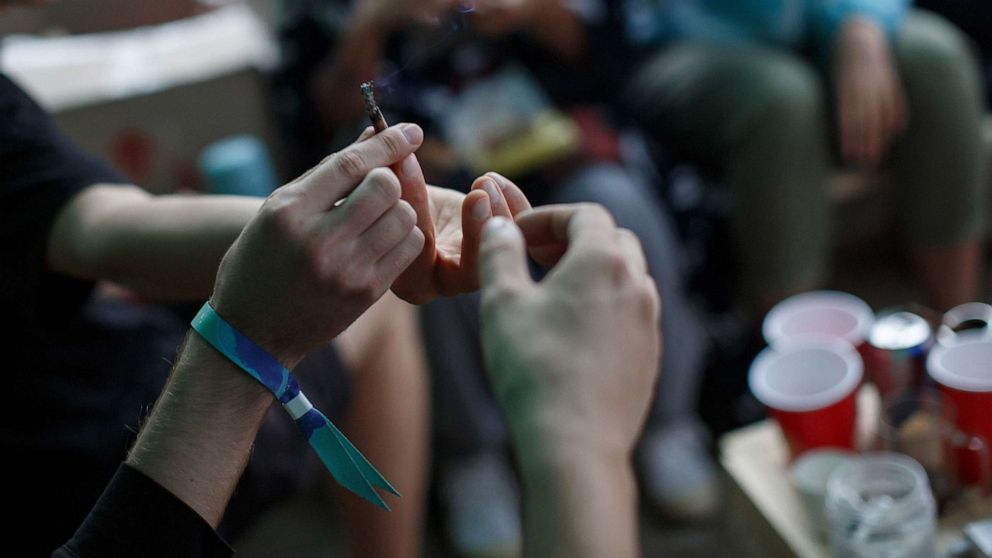 PHOTO: This stock photo shows teens passing a marijuana joint at a party.