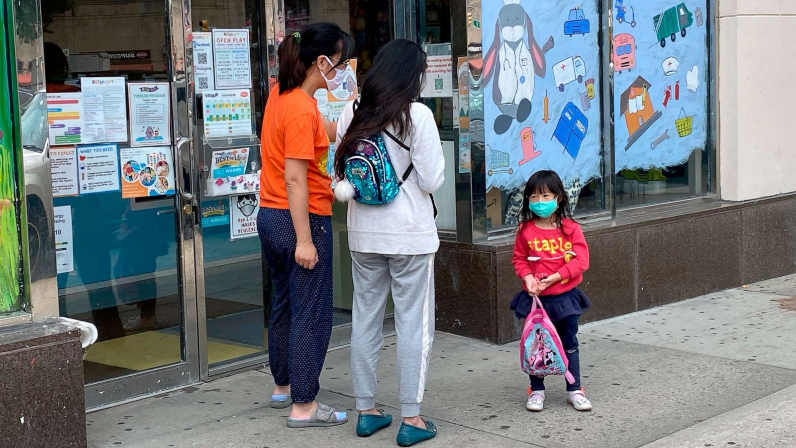 PHOTO: A parent picks up their child at daycare in Queens, N.Y., June 1, 2021.