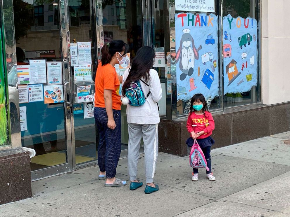 PHOTO: A parent picks up their child at daycare in Queens, N.Y., June 1, 2021.
