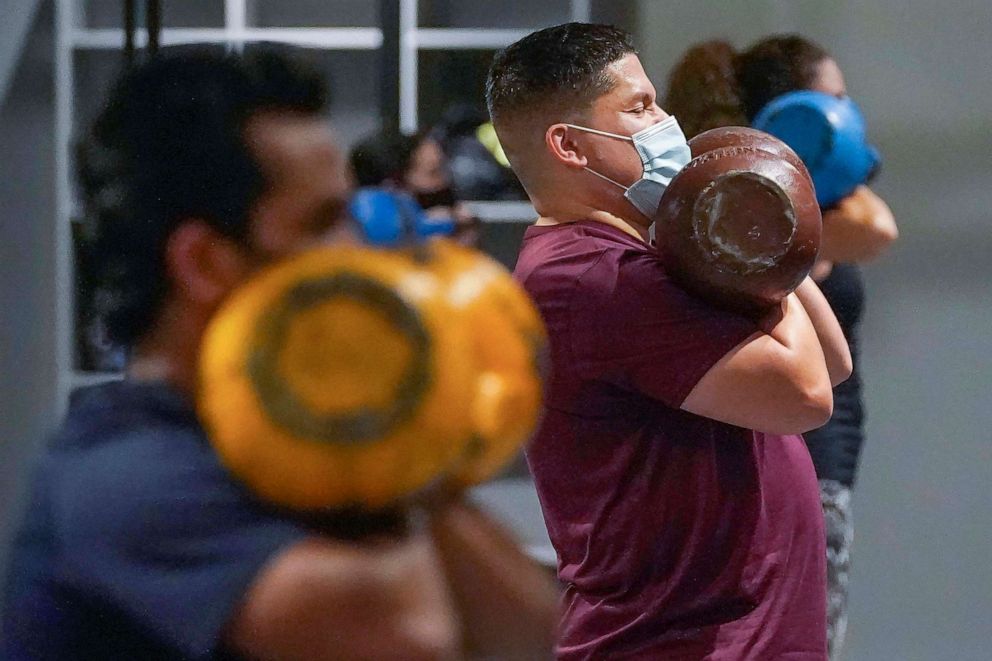 PHOTO: People wear masks while working out in an indoor class at a Hit Fit SF gym amid the coronavirus outbreak in San Francisco, Nov. 24, 2020.