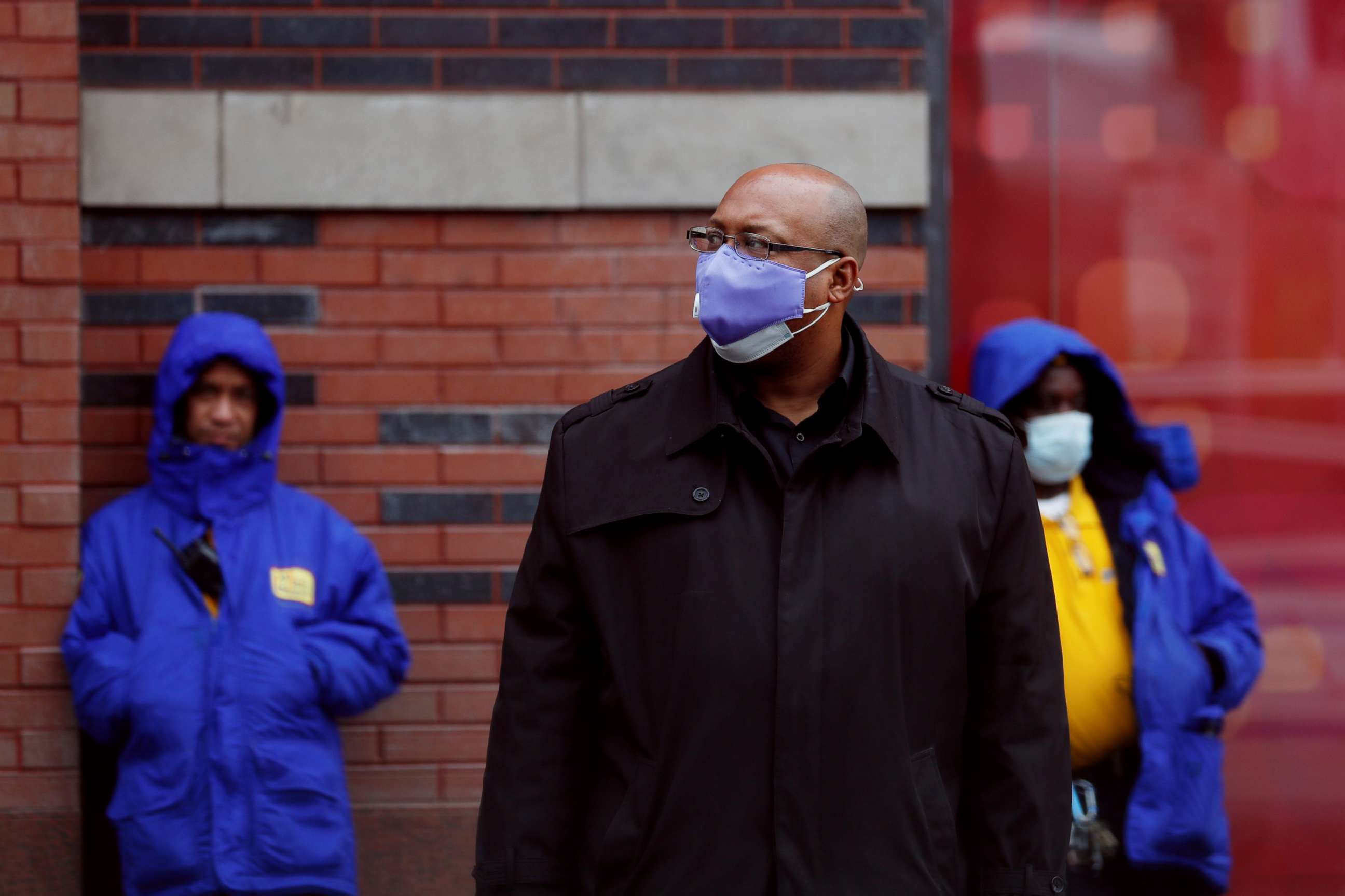 PHOTO: Commuters wear masks while waiting for a bus as the outbreak of coronavirus continues in the Manhattan borough of New York City, on May 8, 2020.