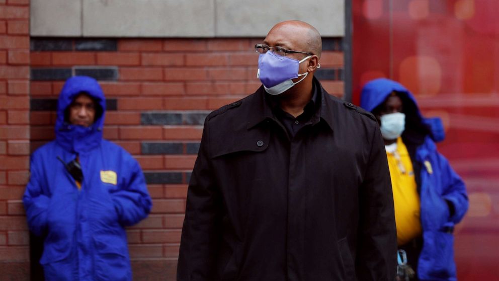 PHOTO: Commuters wear masks while waiting for a bus as the outbreak of coronavirus continues in the Manhattan borough of New York City, on May 8, 2020.