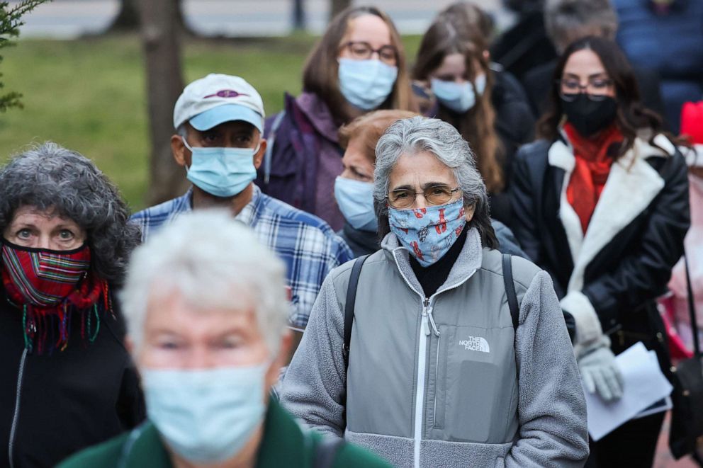 PHOTO: A crowd of people wearing masks after a show ended at the Patchogue Theatre for the Performing Arts, Dec. 21, 2021, in Patchogue, N.Y.