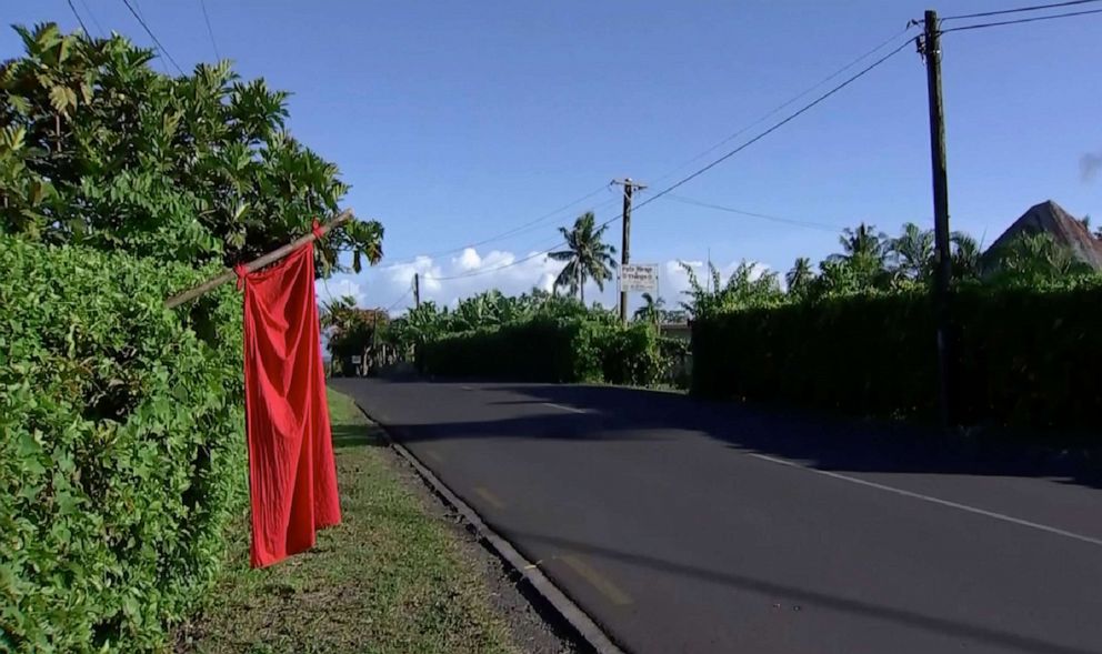 PHOTO: A red flags hangs outside homes of residents who have not been vaccinated in Apia, Samoa, Dec. 5, 2019. Streets were eerily quiet as the government stepped up efforts to curb a measles epidemic that has killed scores of people.