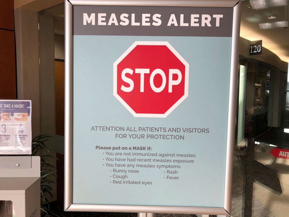 PHOTO: In this Jan. 30, 2019, file photo signs posted at The Vancouver Clinic in Vancouver, Wash., warn patients and visitors of a measles outbreak.