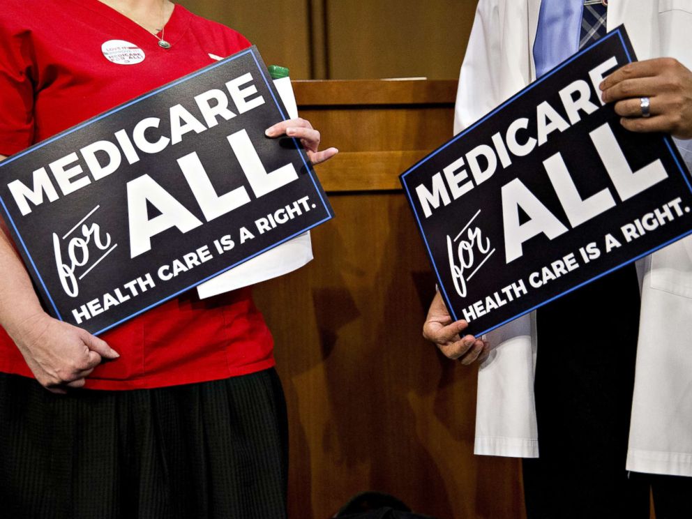 PHOTO: Attendees hold signs while waiting for a health care bill news conference to begin on Capitol Hill in Washington, Sept. 13, 2017.