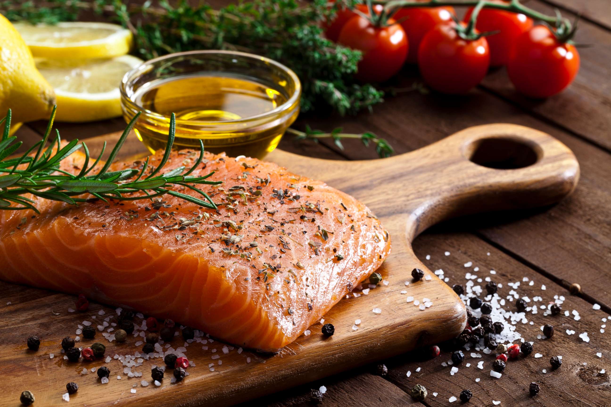 PHOTO: Seasoned salmon and olive oil are prepared in this stock photo.
