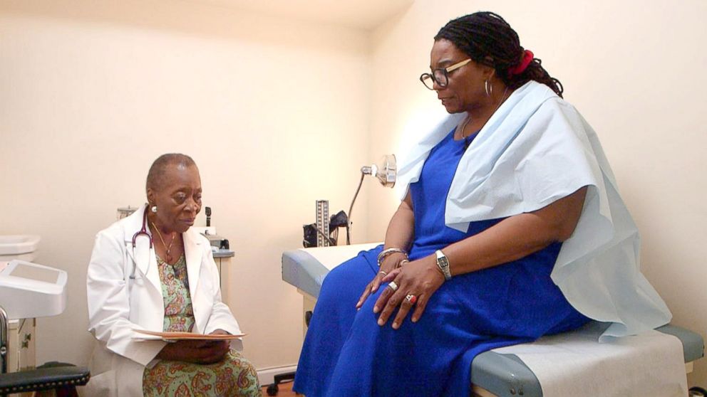 PHOTO: Dr. Melissa Freeman speaks with a patient at her private practice in Harlem, New York.