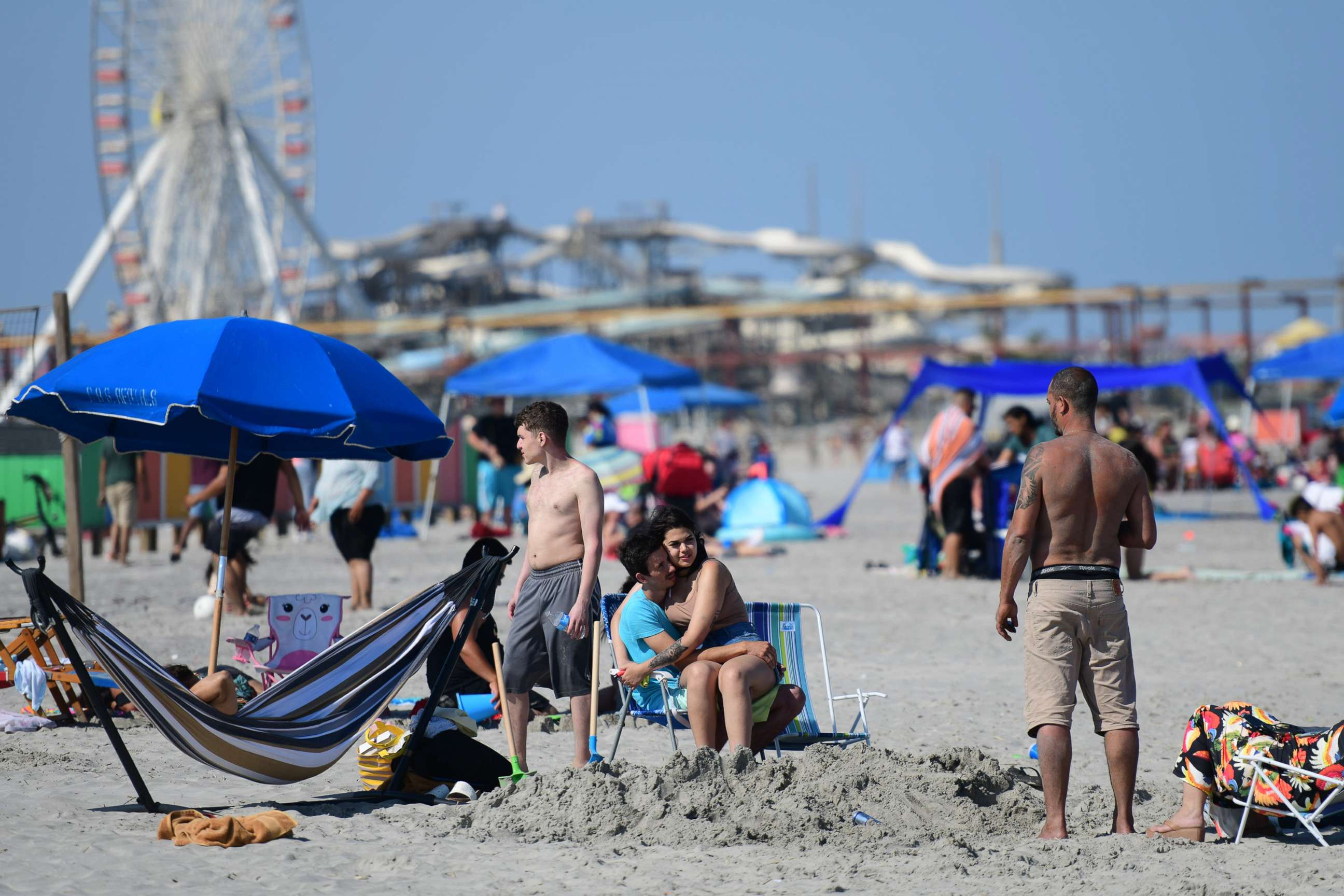 PHOTO: A couple embraces on the beach, May 30, 2022, in Wildwood, N.J. Memorial Day events are held across the U.S. to commemorate those who died in active military service.