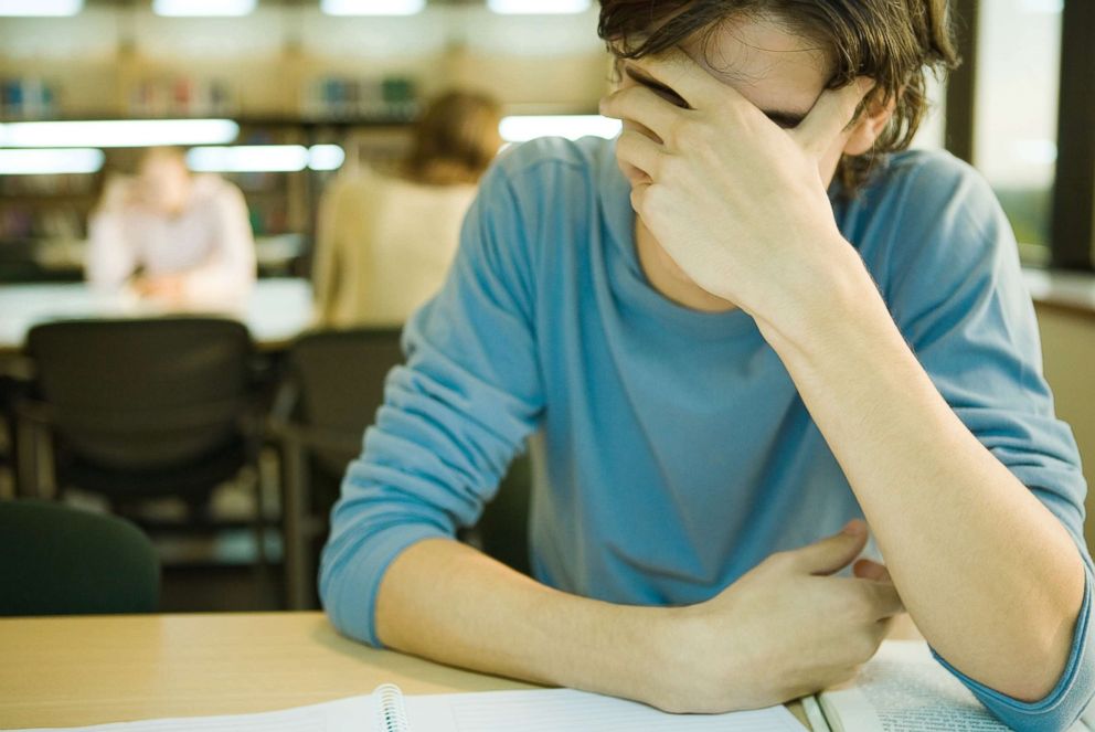 PHOTO: A college student is pictured covering his face in this undated stock photo.