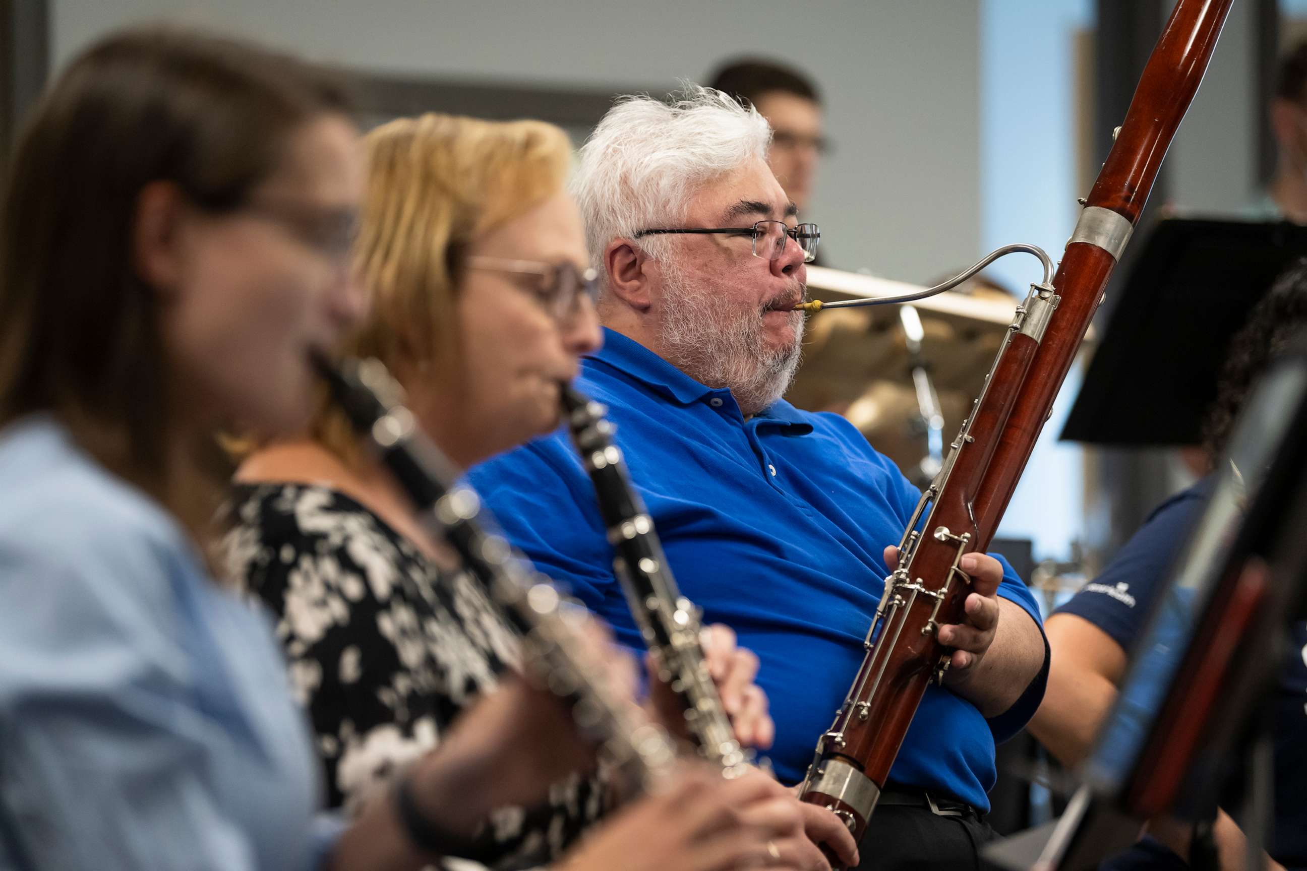 PHOTO: Nurse Ian Barnett plays the bassoon during a rehearsal of AdventHealth's all-employee orchestra, fall 2022.