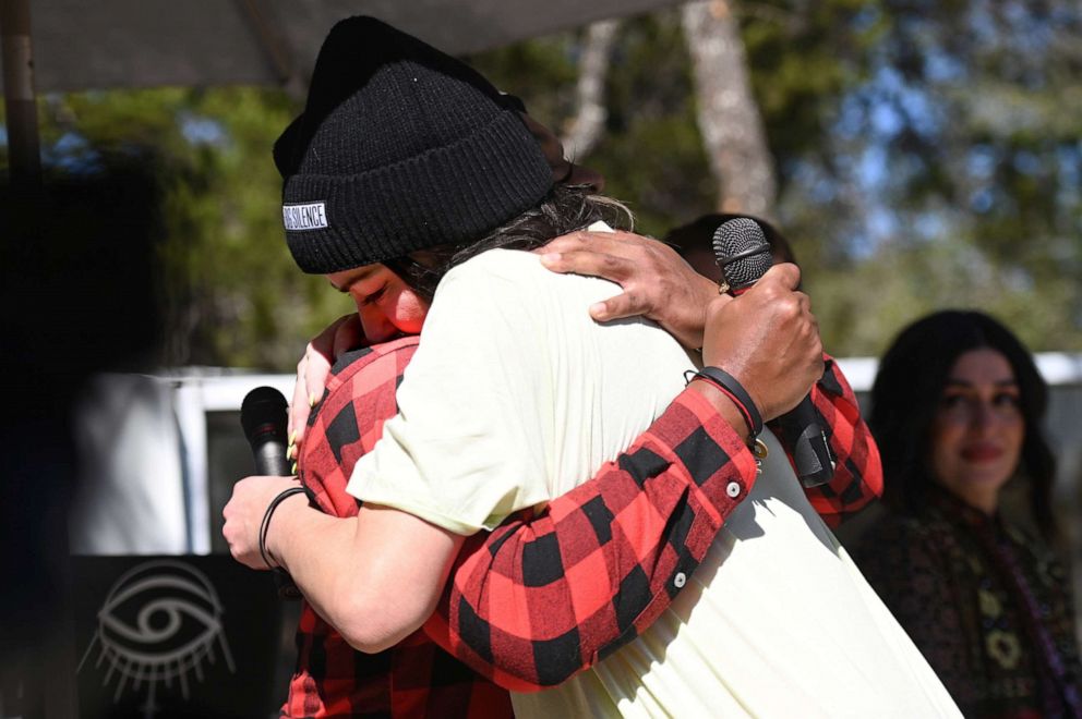 PHOTO: James Nicholas Kinney, and Karena Dawn, Founder of The Big Silence, embrace at the launch of The Big Silence Foundation, a charitable organization dedicated to normalizing conversations around mental health, on March 12, 2022 in Austin, Texas.