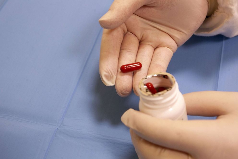 PHOTO: Doctor holds in her hands the Lagevrio pill, Molnupiravir indicator for the treatment of Covid 19 on Jan. 11, 2022 in Bari, Italy.