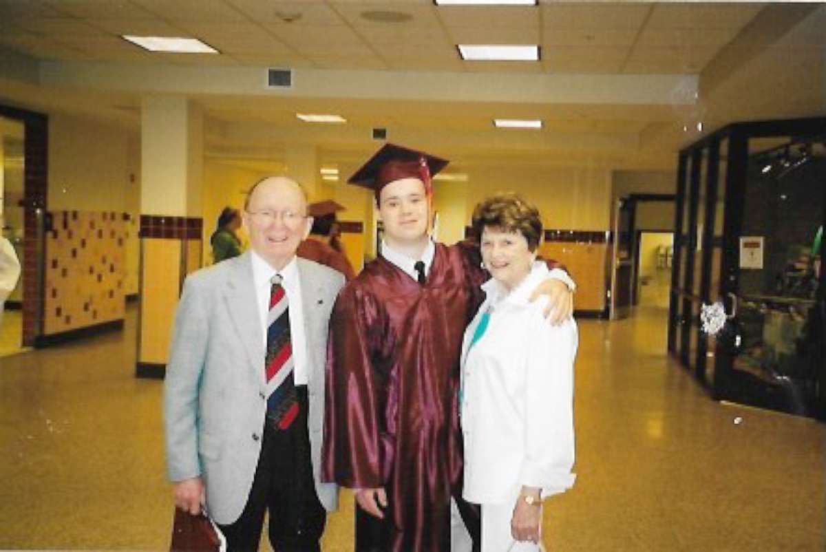 PHOTO: Michael Clayburgh, center, poses with his grandfather and a family member at his high school graduation.