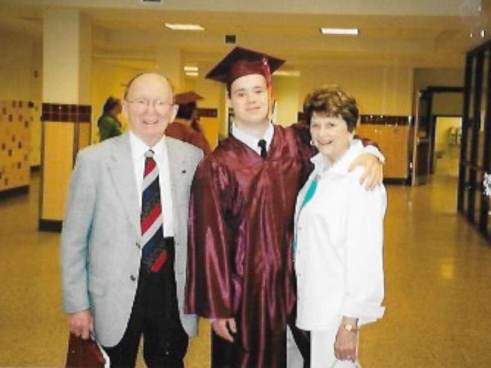 PHOTO: Michael Clayburgh, center, poses with his grandfather and a family member at his high school graduation.