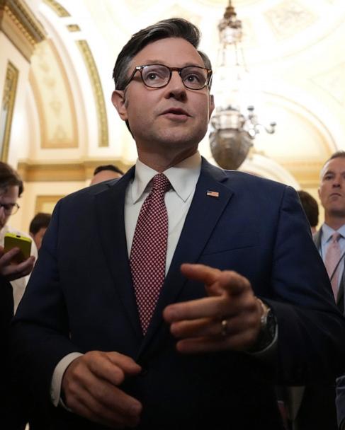 Speaker Mike Johnson speaks to reporters as he leaves the House Chamber at the U.S. Capitol, May 15, 2025 in Washington.