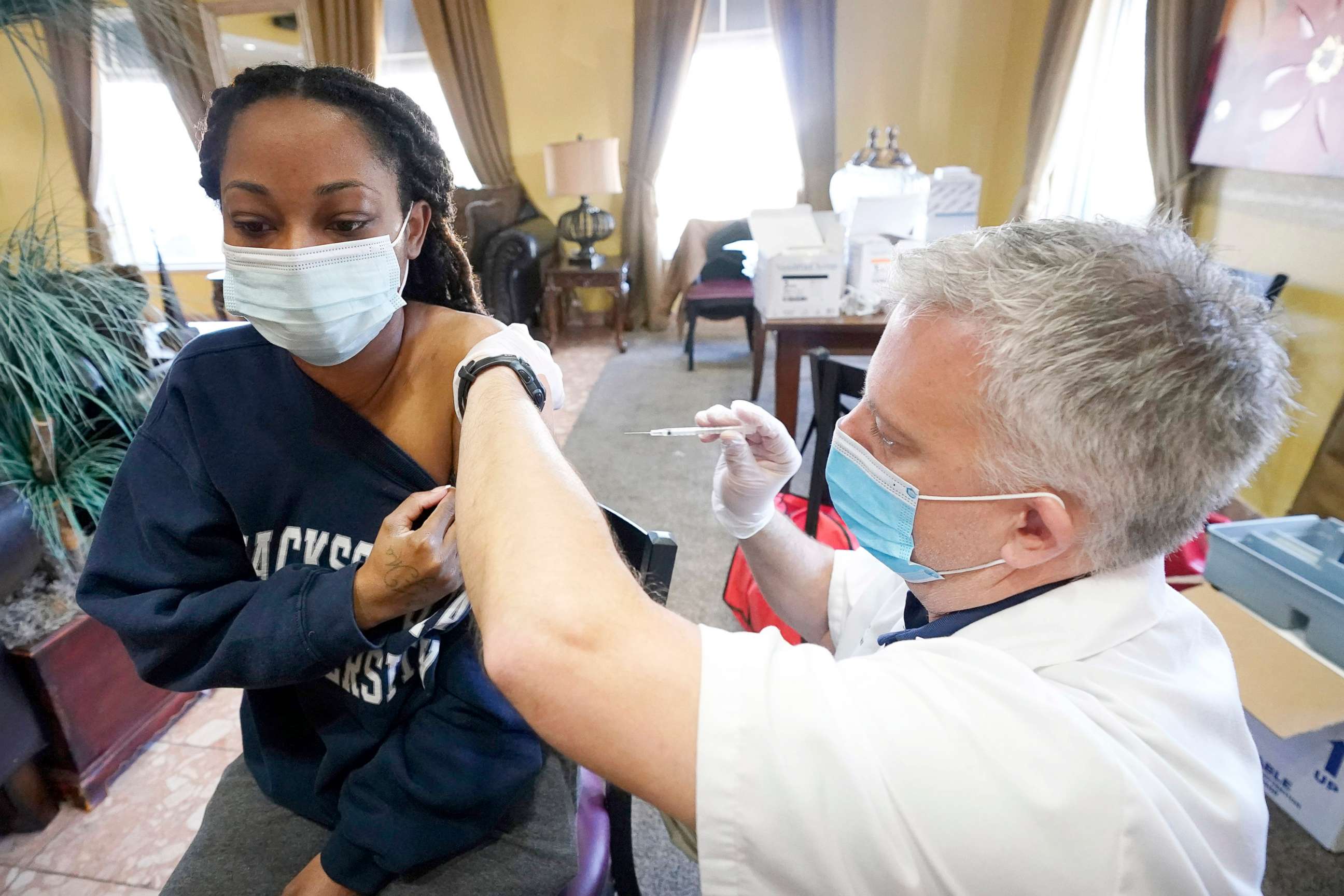 PHOTO: A Walgreens pharmacist prepares to vaccinate a  Harmony Court Assisted Living employee with the Pfizer-BioNTech COVID-19 vaccine on Jan. 12, 2021, in Jackson, Miss. 