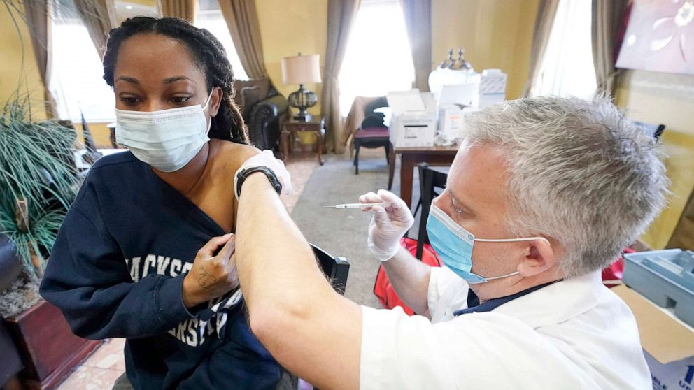 PHOTO: A Walgreens pharmacist prepares to vaccinate a Harmony Court Assisted Living employee with the Pfizer-BioNTech COVID-19 vaccine on Jan. 12, 2021, in Jackson, Miss. 