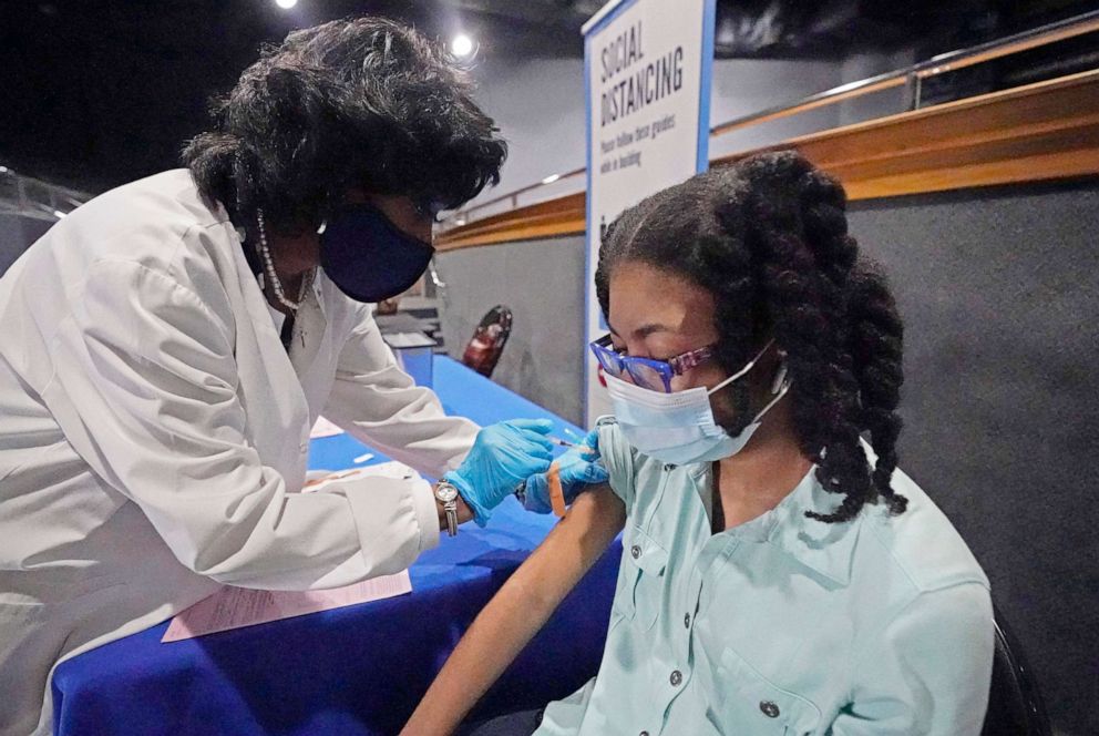 PHOTO: A nurse with Jackson-Hinds Comprehensive Health Center gives a dose of the Pfizer vaccine to a 14-year-old girl at an open COVID-19 vaccination site at Jackson State University in Jackson, Miss., July 27, 2021.