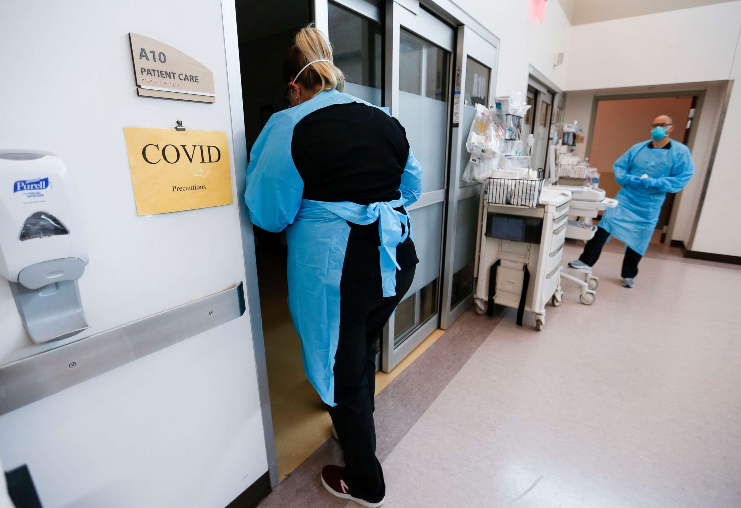 PHOTO: Nurses and doctors in the CoxHealth Emergency Department in Springfield, Mo., don personal protective equipment to treat patients with COVID-19 on July 16, 2021.