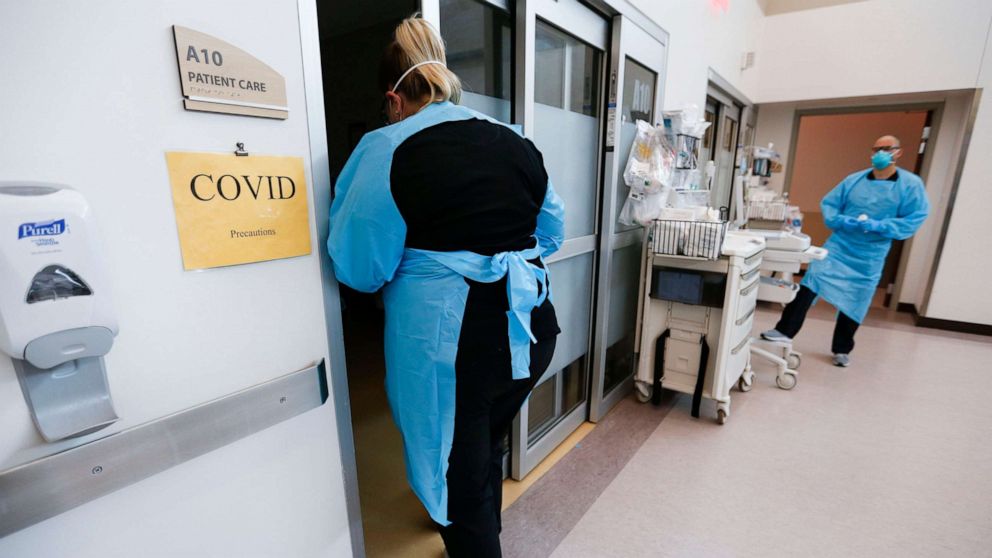 PHOTO: Nurses and doctors in the CoxHealth Emergency Department in Springfield, Mo., don personal protective equipment to treat patients with COVID-19 on July 16, 2021.