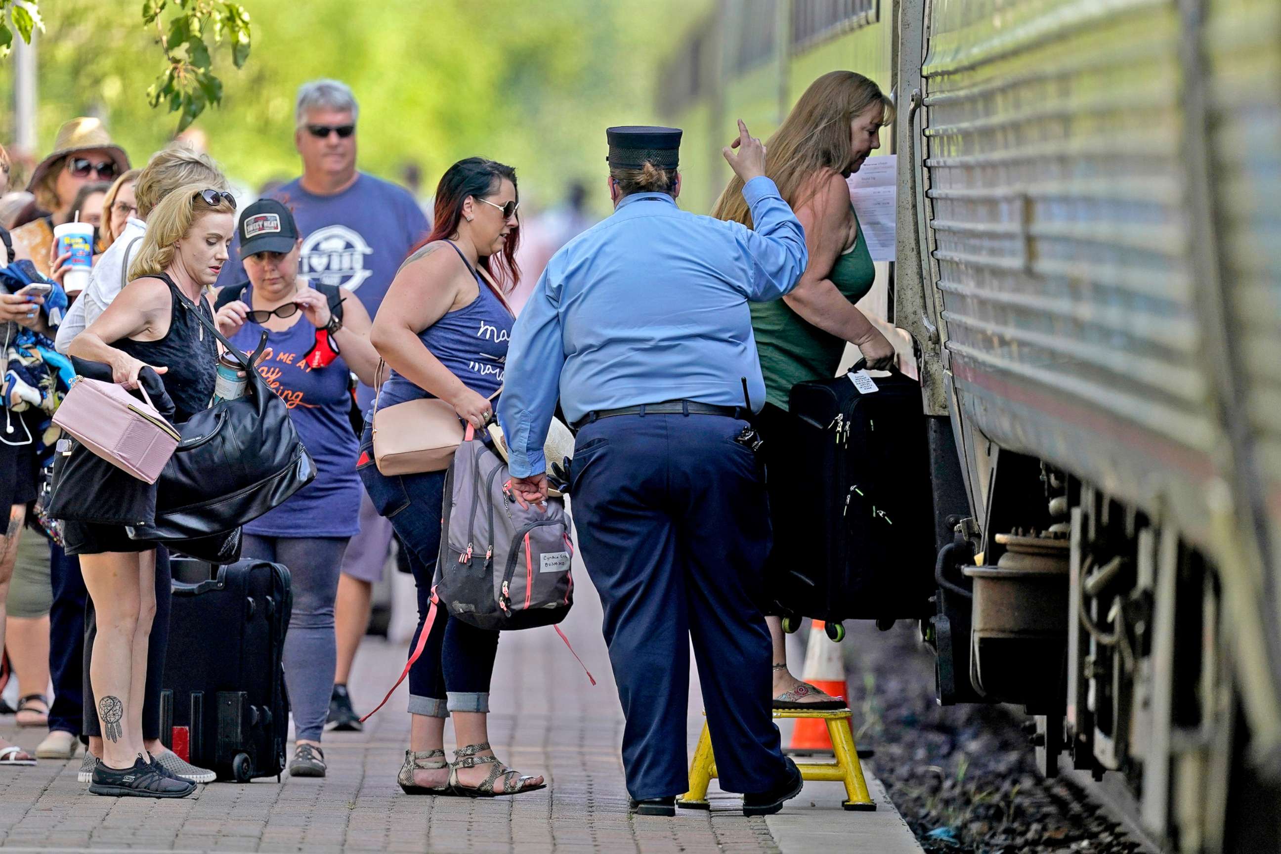 PHOTO: Passengers board a Missouri River Runner Amtrak train in Lee's Summit, Mo., June 11, 2021. Missouri is seeing an rise in COVID-19 cases because of a combination of the fast-spreading delta variant and people's resistance to getting vaccinated.