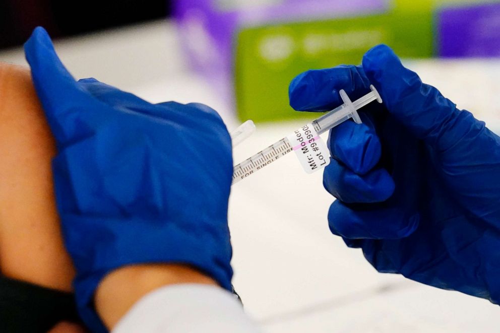 PHOTO: A health worker administers a dose of a Moderna COVID-19 vaccine during a vaccination clinic at the Norristown Public Health Center in Norristown, Pa., Dec. 7, 2021. 