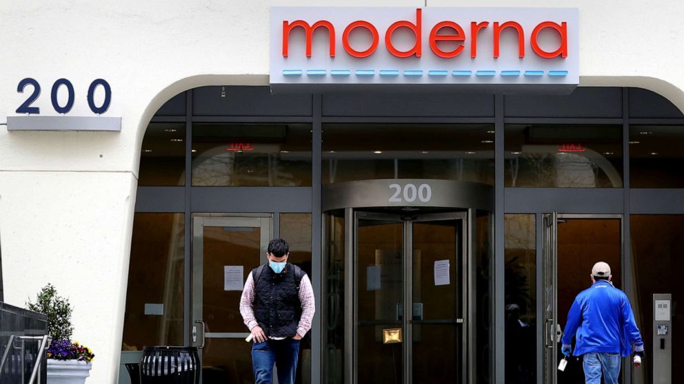 PHOTO: People come and go outside Moderna headquarters in Cambridge, Mass., May 8, 2020.