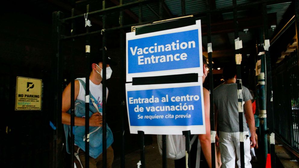 PHOTO: (FILES) In this file photo taken on July 17, 2022 people wait in line to recieve the Monkeypox vaccine before the opening of a new mass vaccination site at the Bushwick Education Campus in Brooklyn in New York City. 