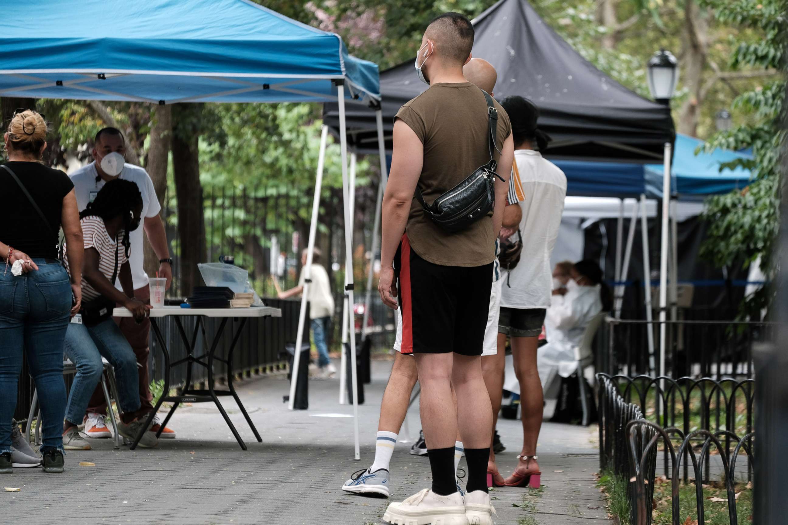 PHOTO: People line up to speak with healthcare workers with New York City Department of Health and Mental Hygiene at intake tents where individuals register to receive the monkeypox vaccine, Aug. 5, 2022 in New York City.