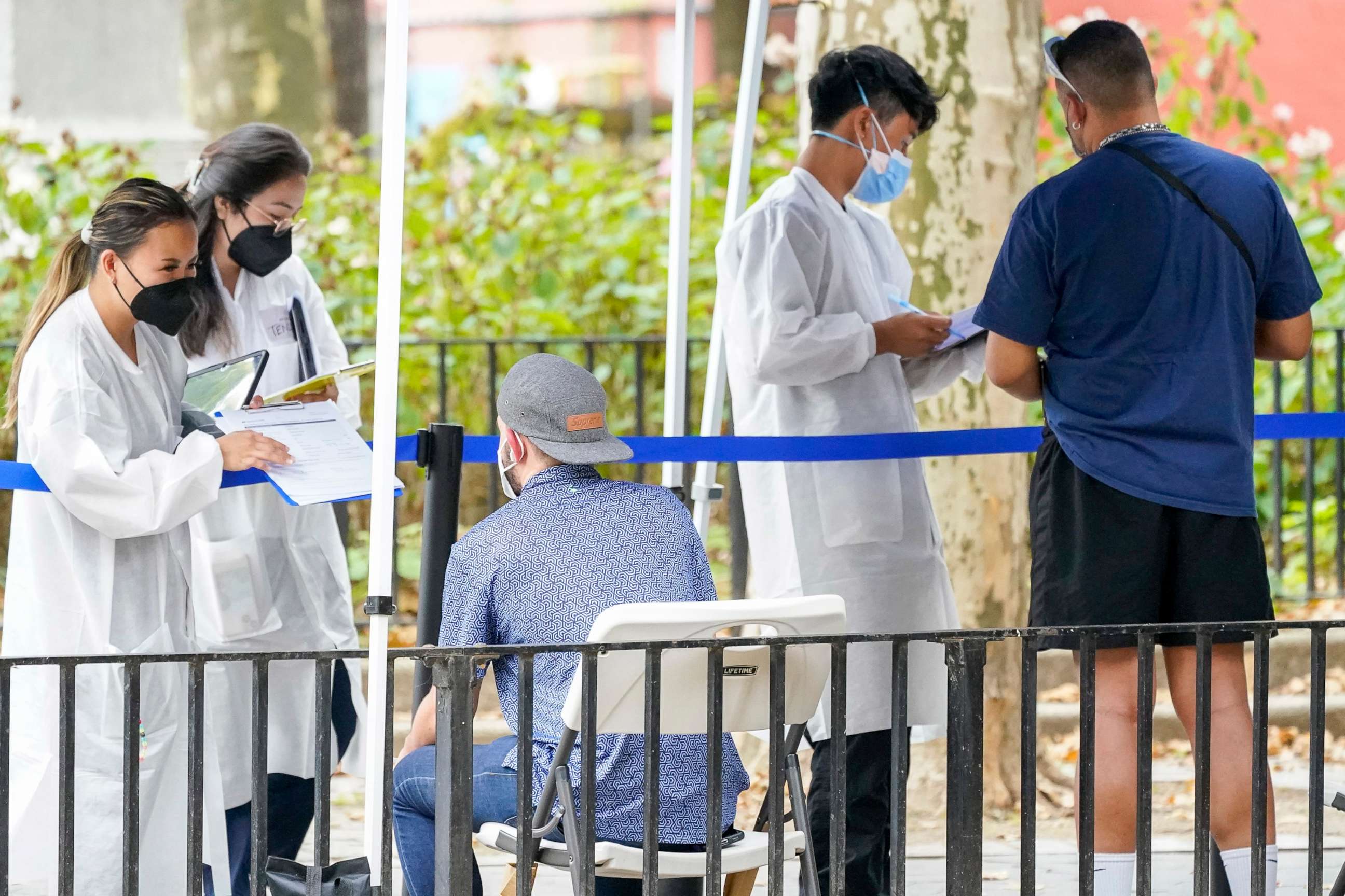 PHOTO: Healthcare workers with New York City Department of Health and Mental Hygiene help people register for the monkeypox vaccine at one of the City's vaccination sites, July 26, 2022, in New York. 