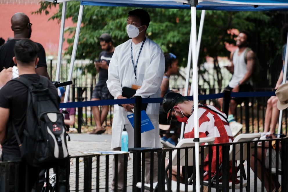 PHOTO: Healthcare workers with the New York City Department of Health and Mental Hygiene work at intake tents where individuals are registered to receive the monkeypox vaccine on July 29, 2022 in New York City. 