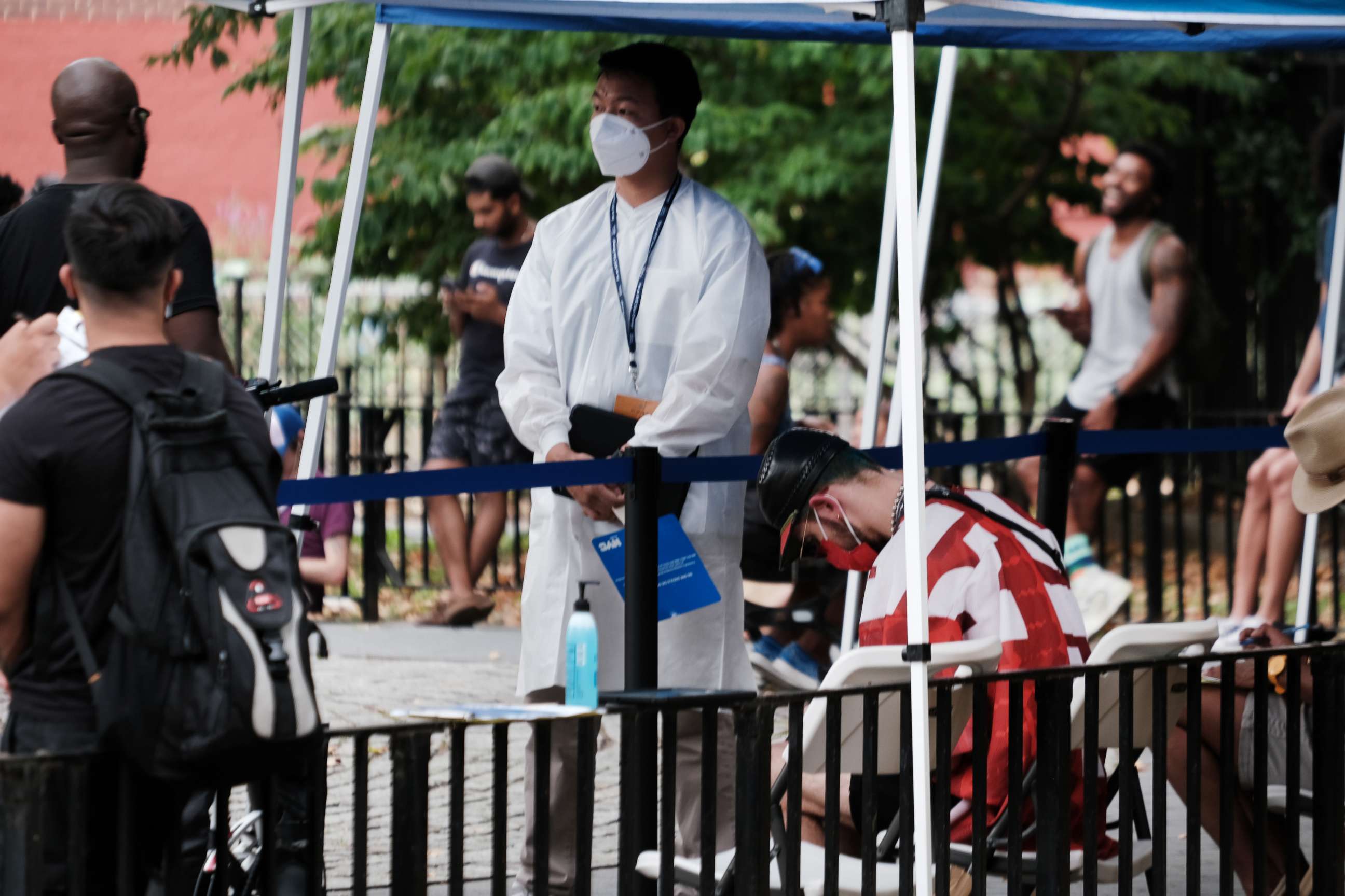 PHOTO: Healthcare workers with New York City Department of Health and Mental Hygiene work at intake tents where individuals are registered to receive the monkeypox vaccine on July 29, 2022 in New York City.