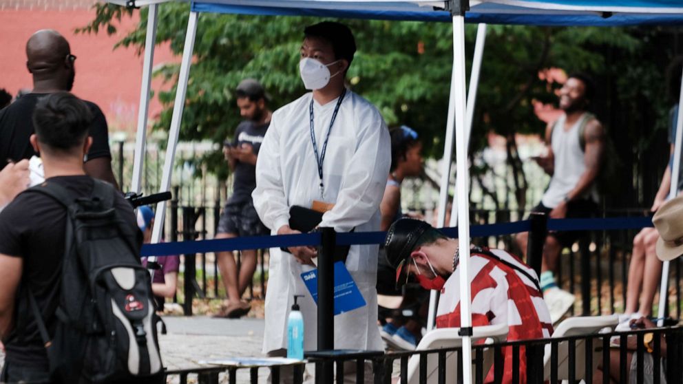 PHOTO: Healthcare workers with New York City Department of Health and Mental Hygiene work at intake tents where individuals are registered to receive the monkeypox vaccine on July 29, 2022 in New York City.