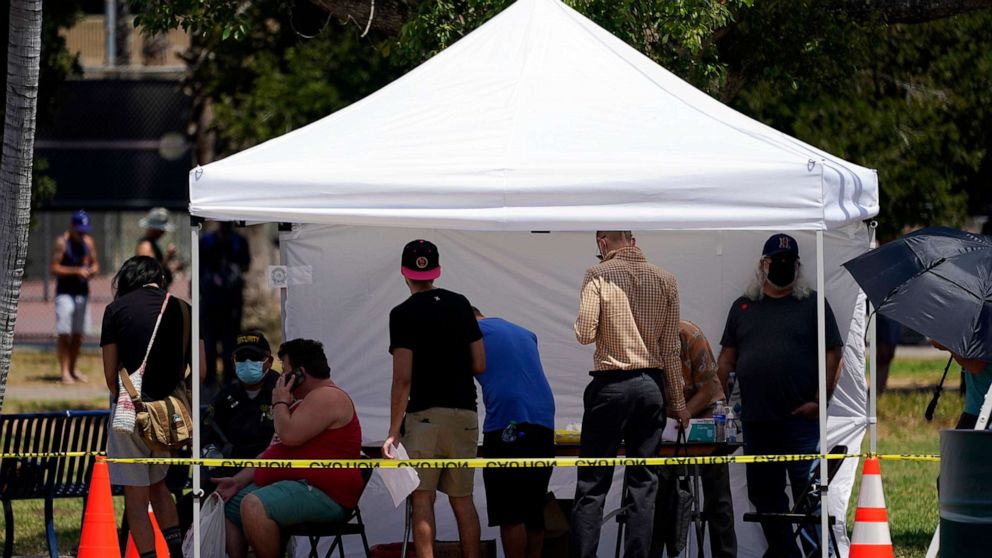 PHOTO: People line up at a monkeypox vaccination site, July 28, 2022, in Encino, Calif.