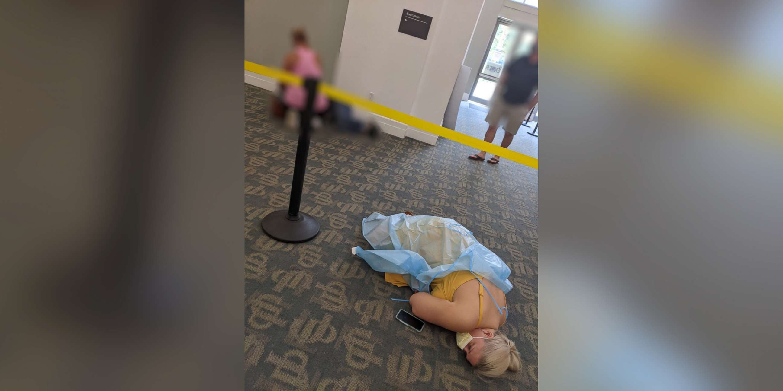 PHOTO: Toma Dean and another patient lie on the floor of a monoclonal antibody site in Jacksonville, Fla., in August 2021.