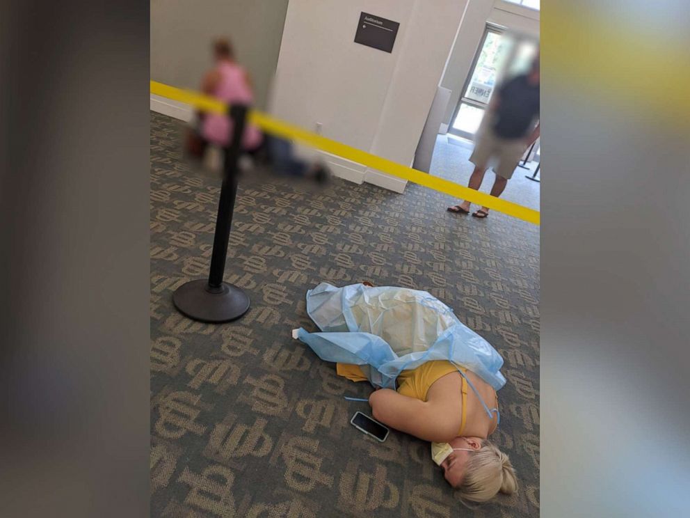 PHOTO: Toma Dean and another patient lie on the floor of a monoclonal antibody site in Jacksonville, Fla., in August 2021.